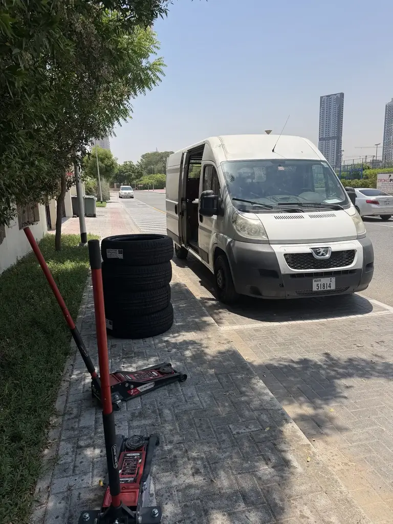 Real mobile tyre service van and replacement tyres at a Dubai job